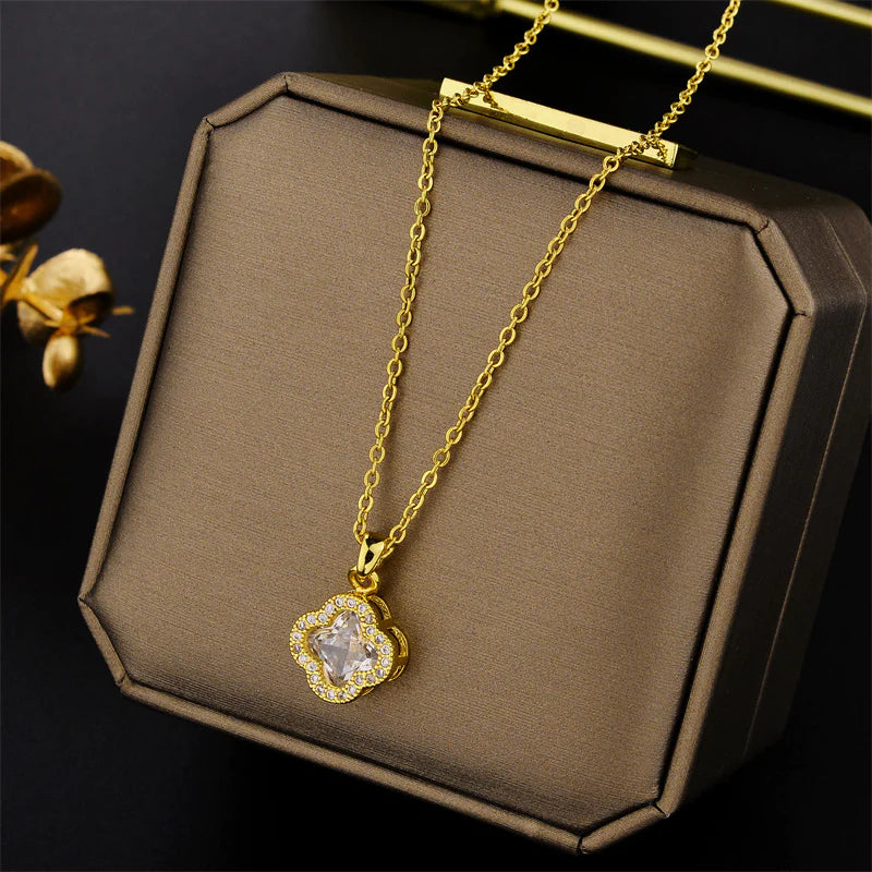 Leaf clover necklace with white gem inside